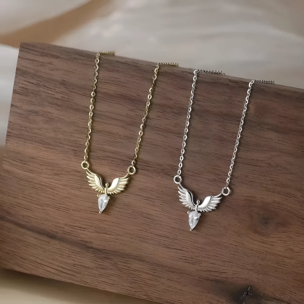 Close-up of a silver eagle pendant necklace on an O-ring chain with white gold plating.