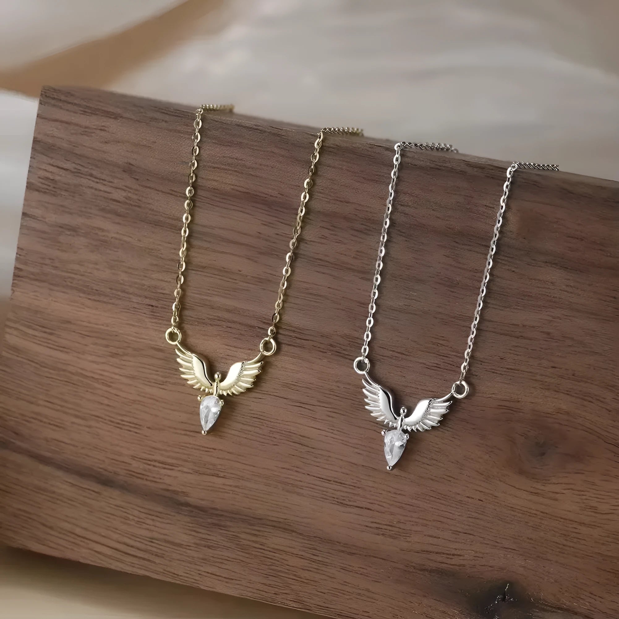 Women's silver eagle pendant necklace on an O-ring chain in white gold or yellow gold colour.