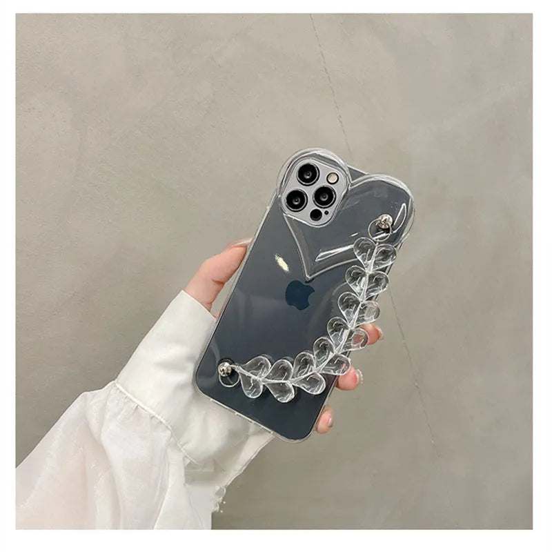 Clear iPhone case with a red love heart and chain design on the back