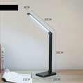 LED desk lamp with wireless charging base and foldable arm in black