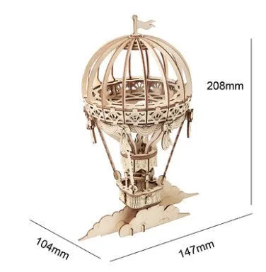 Wooden 3D puzzle model of a radio assembled from pre-cut wood pieces on a white background