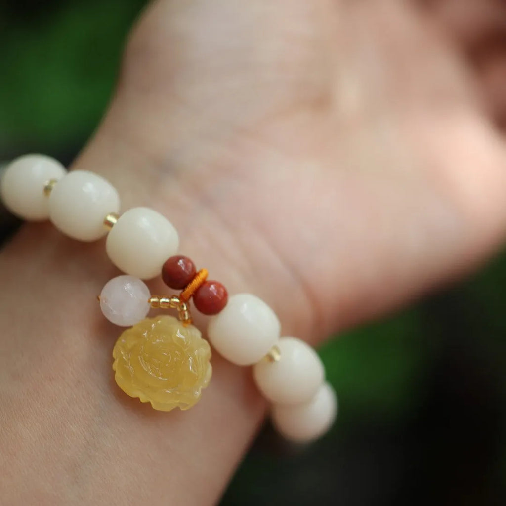 White jade gradient bodhi root bracelet with 10mm floral beads and beeswax lotus decorations