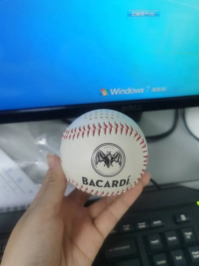 Baseball-shaped Bluetooth speaker in green colour with USB charging port
