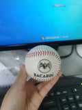 Baseball-shaped Bluetooth speaker in green colour with USB charging port