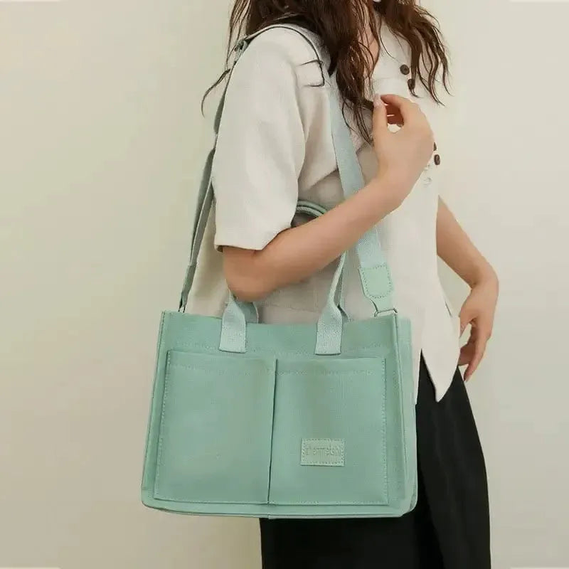 Large capacity canvas tote bag for women with multiple pockets and crossbody strap in creamy white