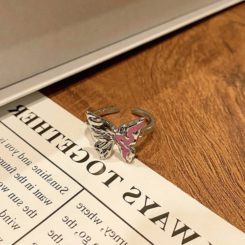 Simple copper women's ring with a Chinese butterfly design, showing an example from the 33 available numbered styles.