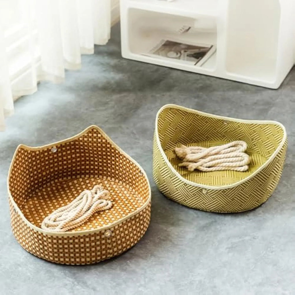 Green rattan cat hammock with metal hooks hanging from a shelf