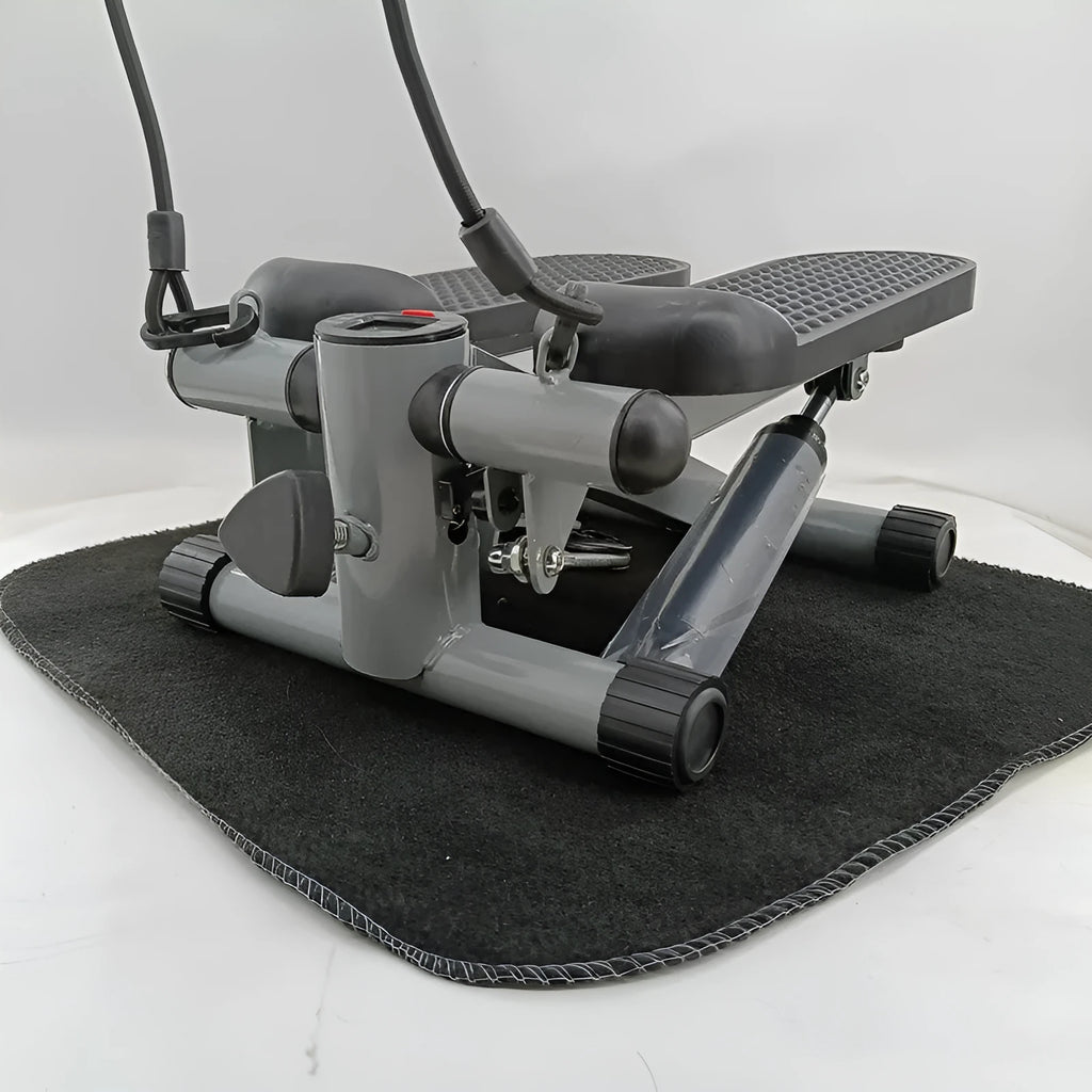 Silver grey hydraulic mini treadmill waist slimming pedal exercise machine for home use.