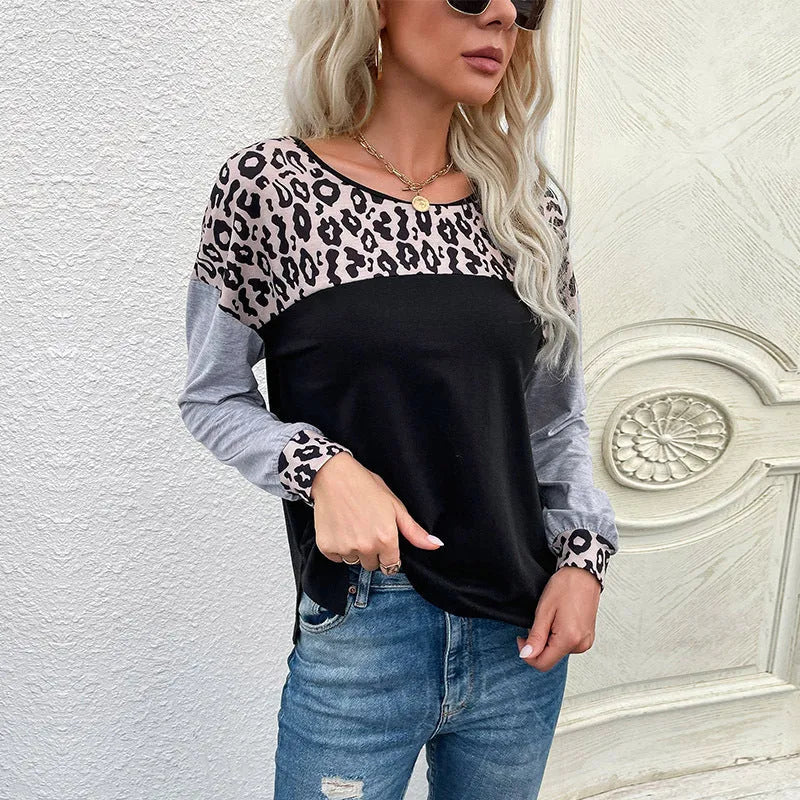 Women's black leopard print patchwork loose fit pullover sweater with round neck and long sleeves