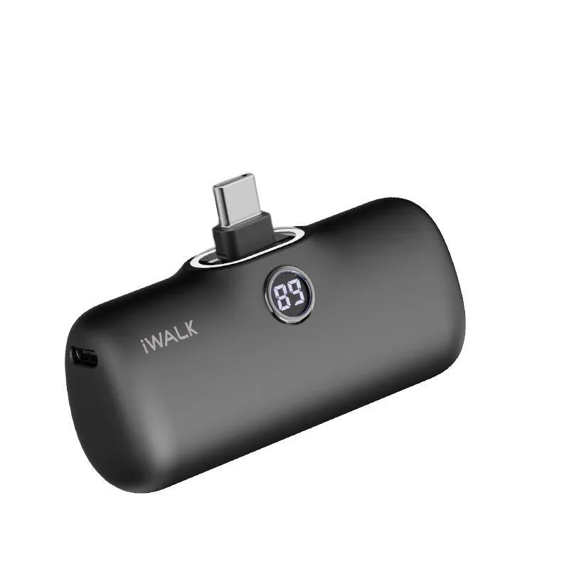 Small white cylindrical lipstick-shaped power bank showing digital battery percentage display on its side.