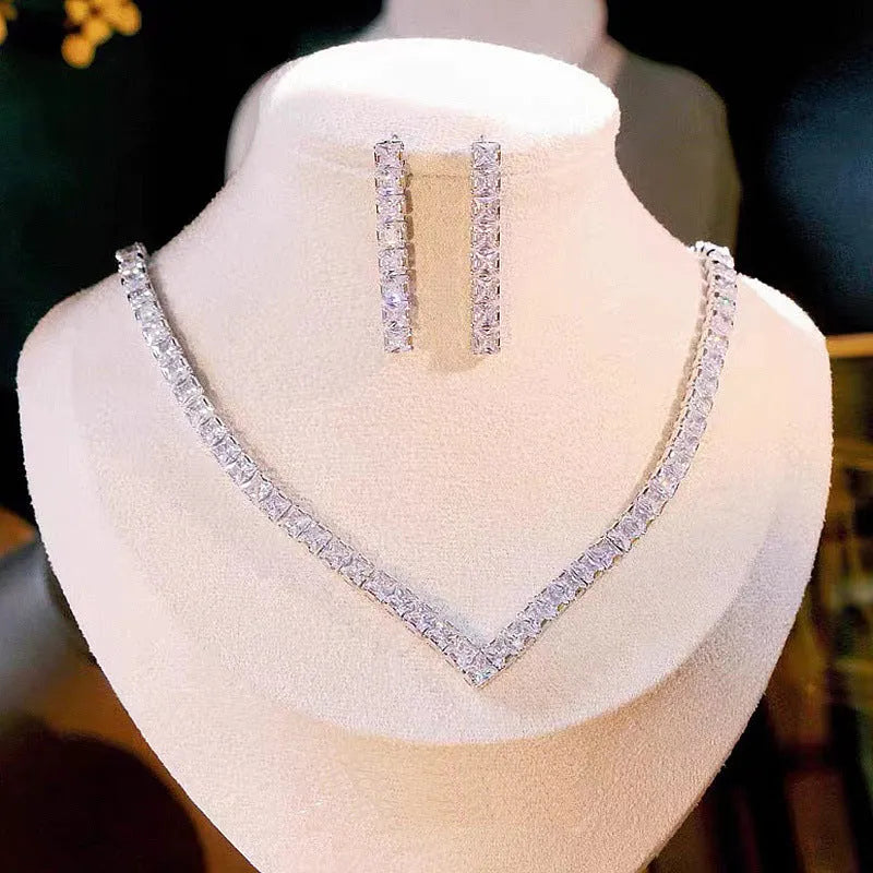 Simple electroplated zircon necklace and earrings set for women in silver with oval and quadrilateral pendant