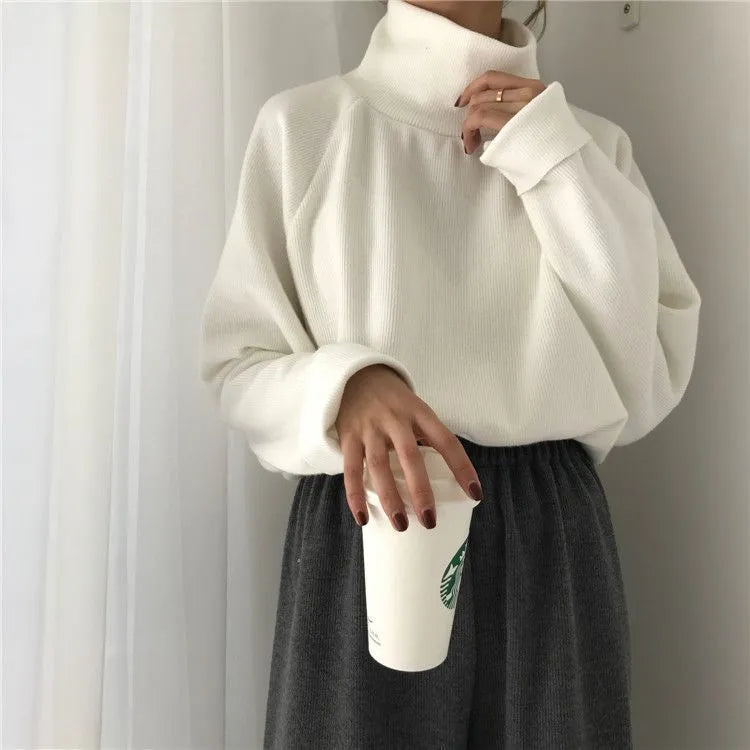 Women's solid colour long-sleeve top with a half-high collar in a loose fit.
