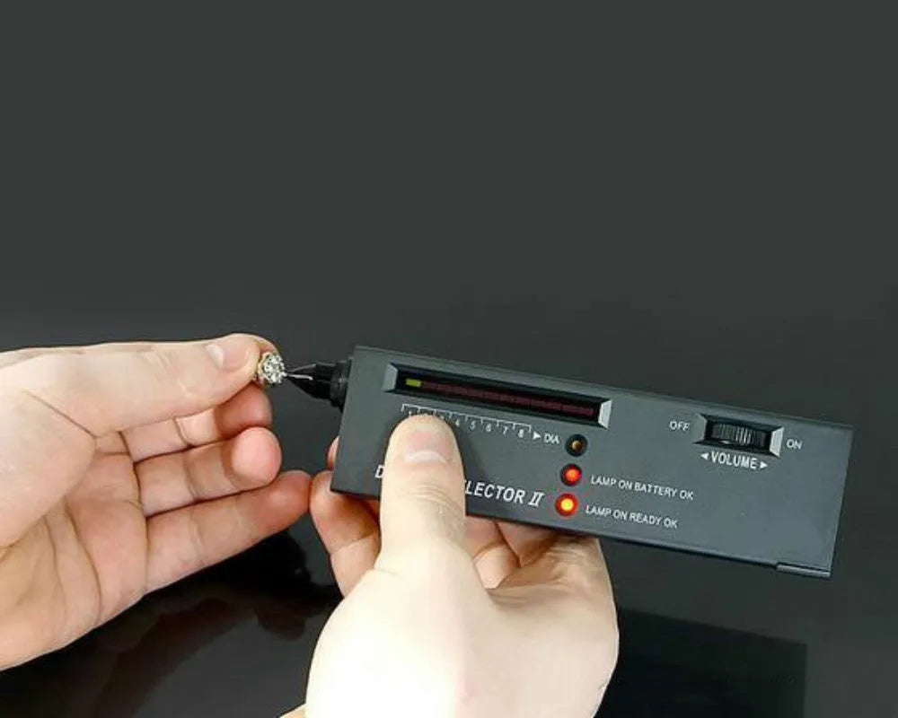 Second generation portable diamond thermal conductivity tester with metal probe on black background