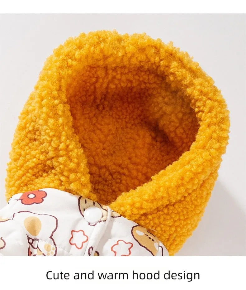 Yellow quilted cotton four-legged dog coat with sherpa hood and animal prints on a small dog