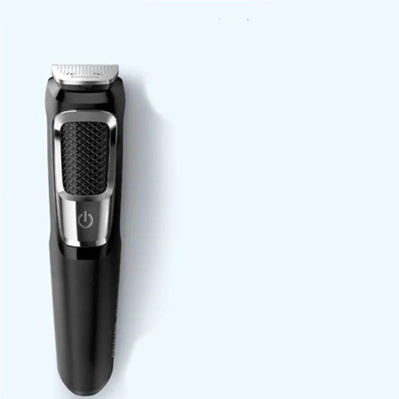 Silver and black multifunctional nose hair and beard trimmer with a cleaning brush on a white background.