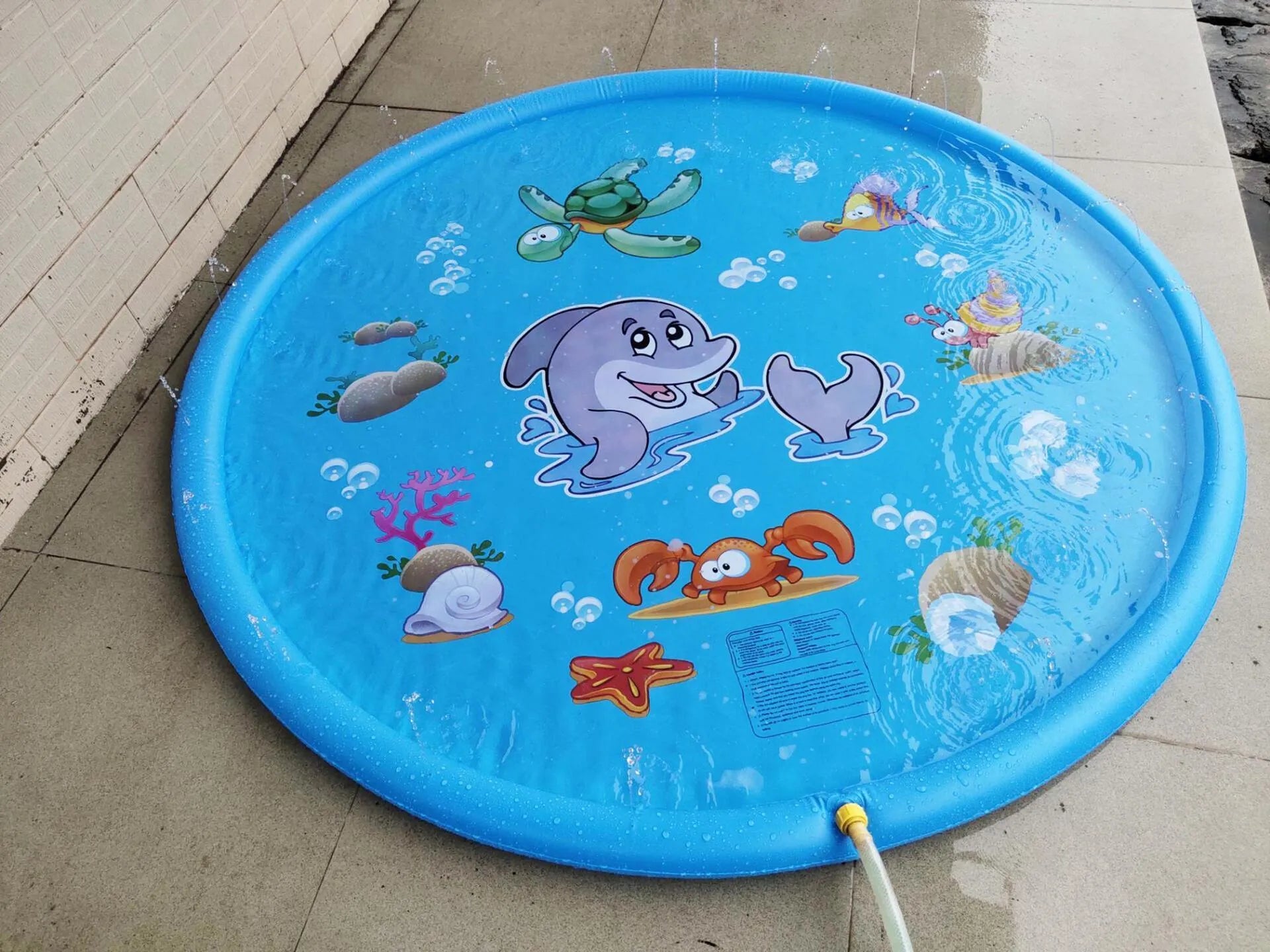 Blue PVC children's water spray play mat with marine animal designs measuring 100x170cm
