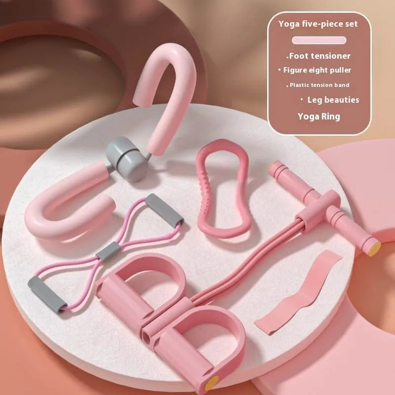 Yoga four piece fitness set with leg stretcher, yoga ring, pedal device, and figure eight tension rope on a plain background