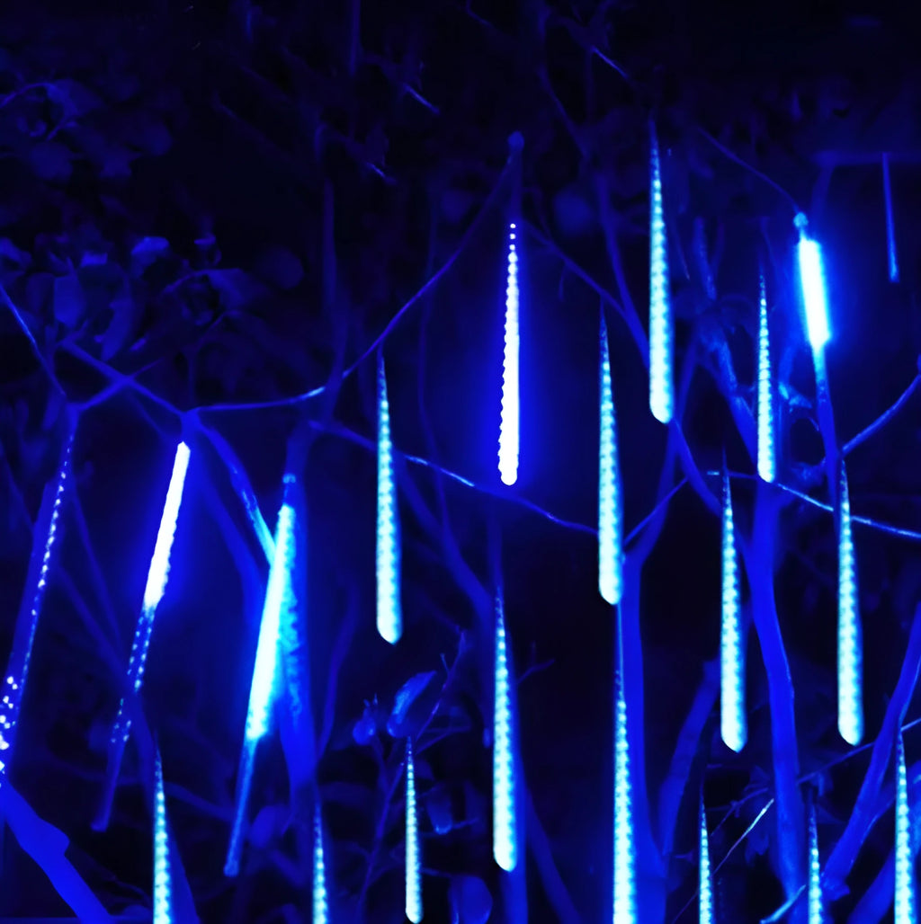 Outdoor waterproof LED meteor shower lights in garden installation showing realistic falling star lighting effects