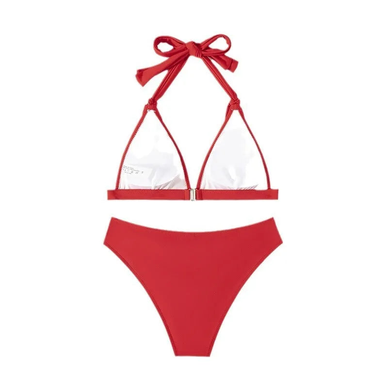 Red women's halterneck bikini with adjustable tie and high-cut shorts for swimming
