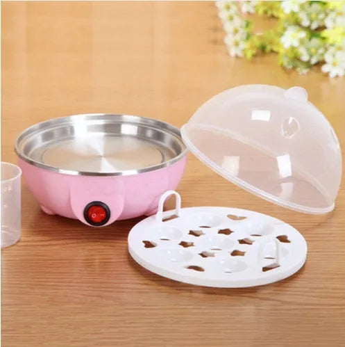 Blue electric egg steamer with transparent lid and egg tray on countertop