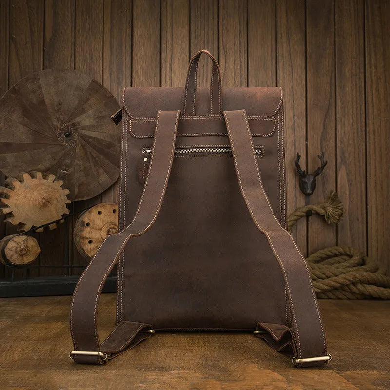 Dark brown genuine leather men's travel bag with shoulder straps and top handle.