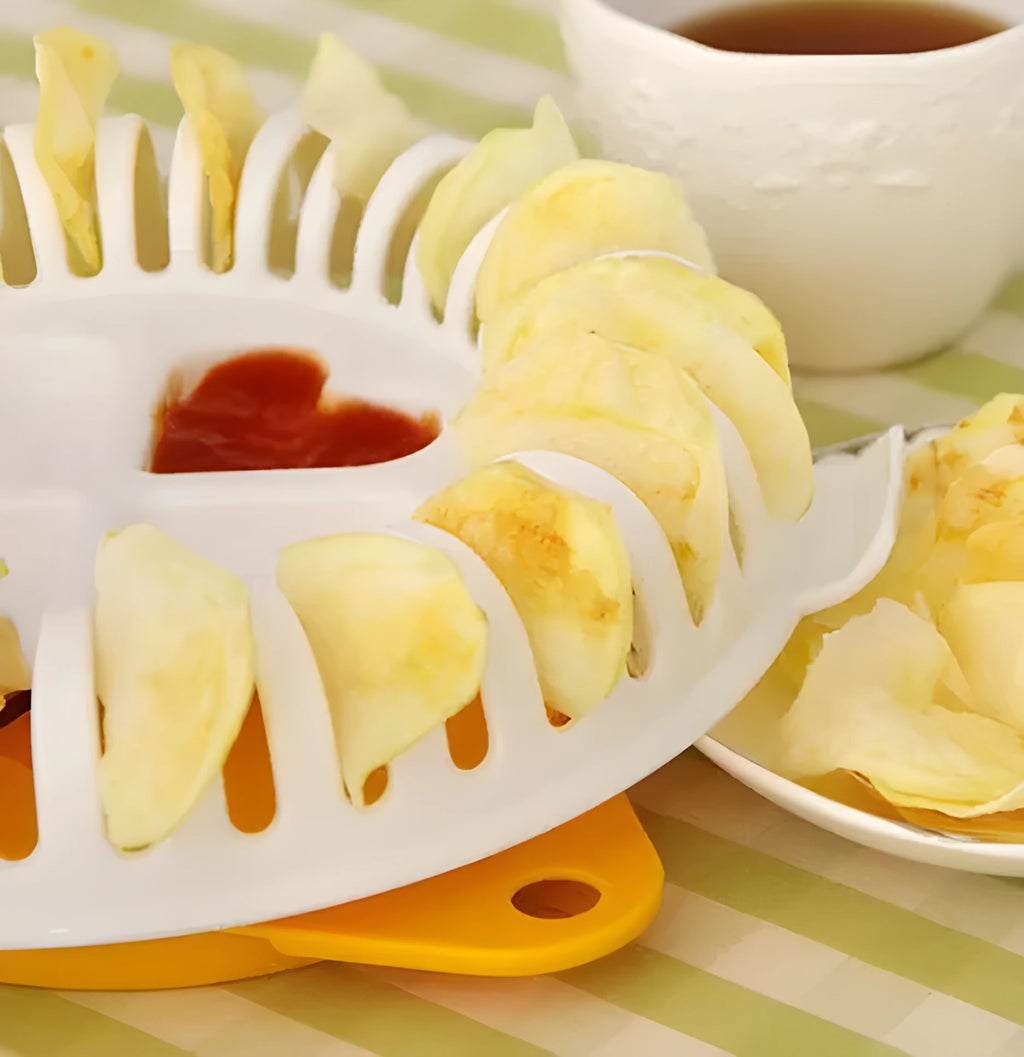 White plastic potato chips maker set with tray, stander, and slicer on a kitchen surface