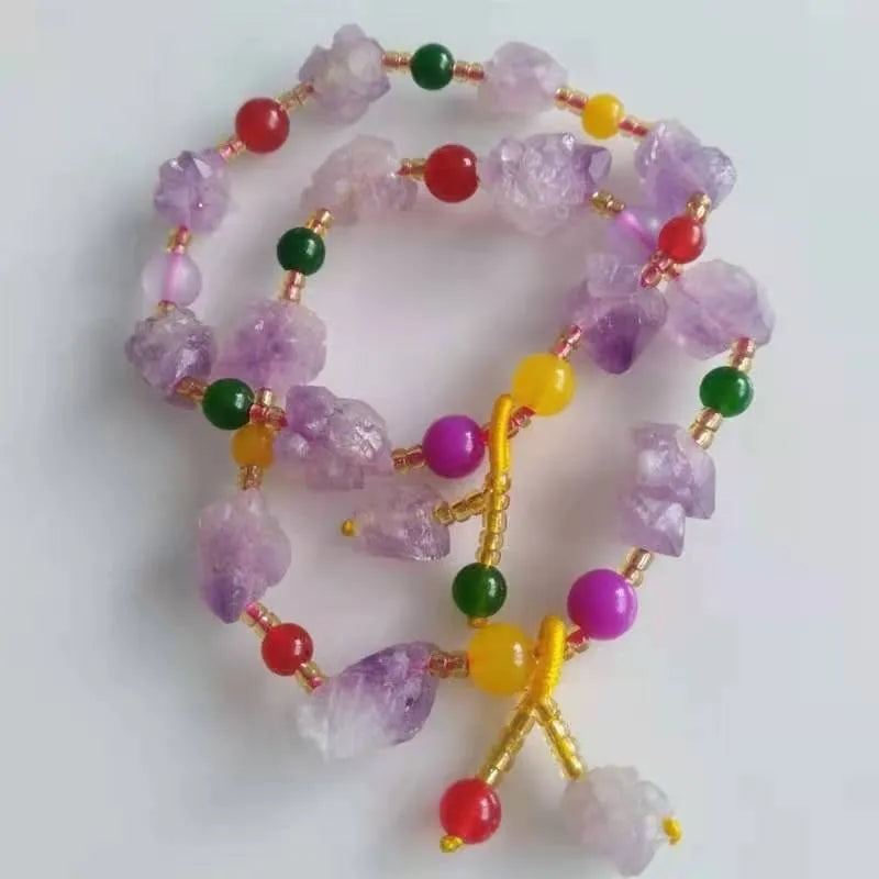 Women's natural amethyst bracelet with a fu character engraved on the central bead.
