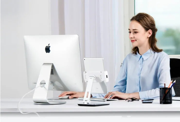 Folding aluminium phone and tablet stand in black showing 360° rotation and anti-slip silicone pads