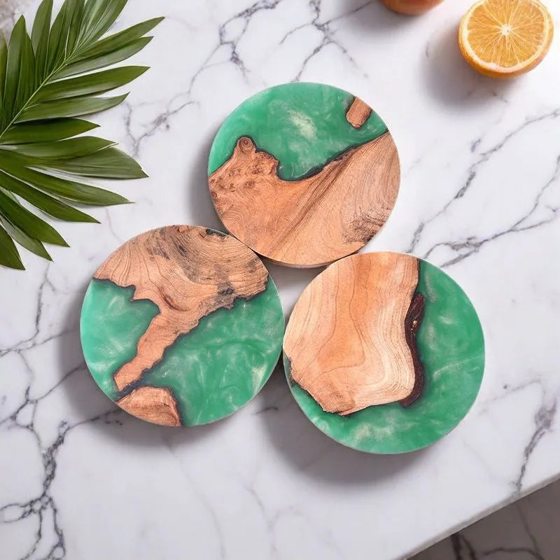 A solid colour resin coaster on a wooden table, showing its 1cm thickness and irregular Nordic shape.