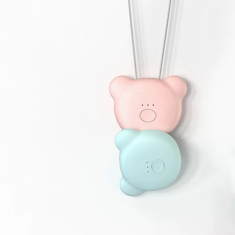 Mini USB portable air purifier necklace in blue, shown worn and with USB cable.