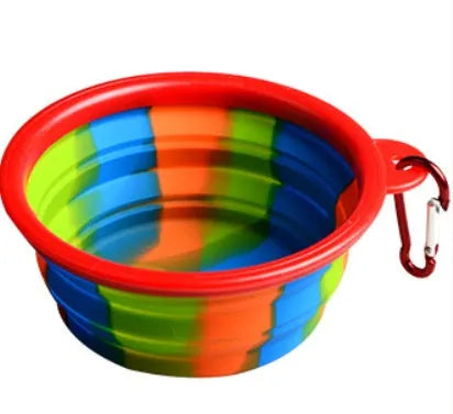 Collapsible silicone dog bowl in camouflage pattern folded flat on green surface