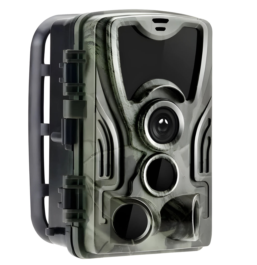 Green outdoor trail camera with lens and infrared LEDs, shown with belt strap for mounting on a tree.