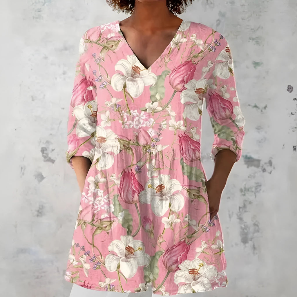 Women's retro patterned long-sleeved top with V-neck on a hanger
