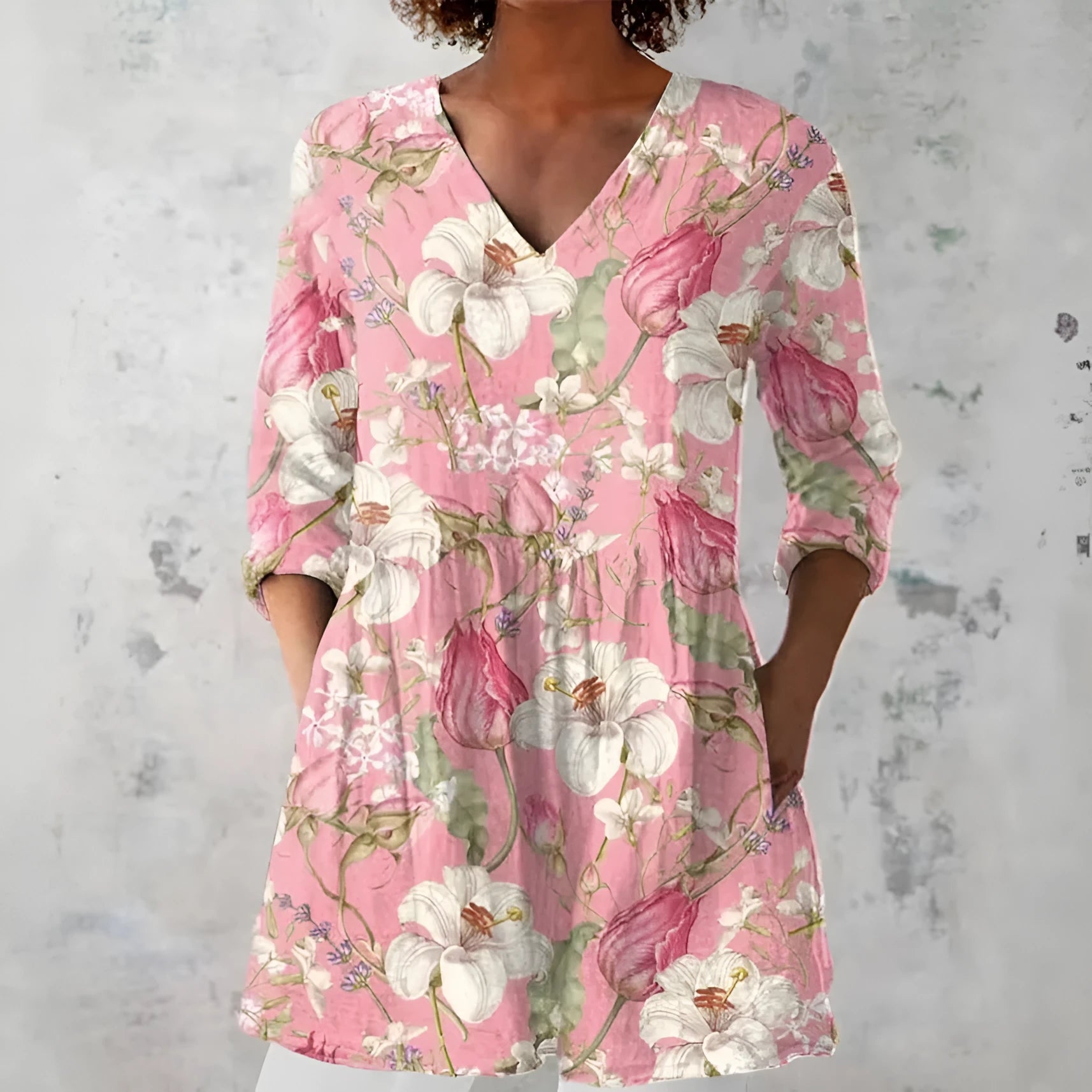 Women's retro patterned long-sleeved top with V-neck on a hanger
