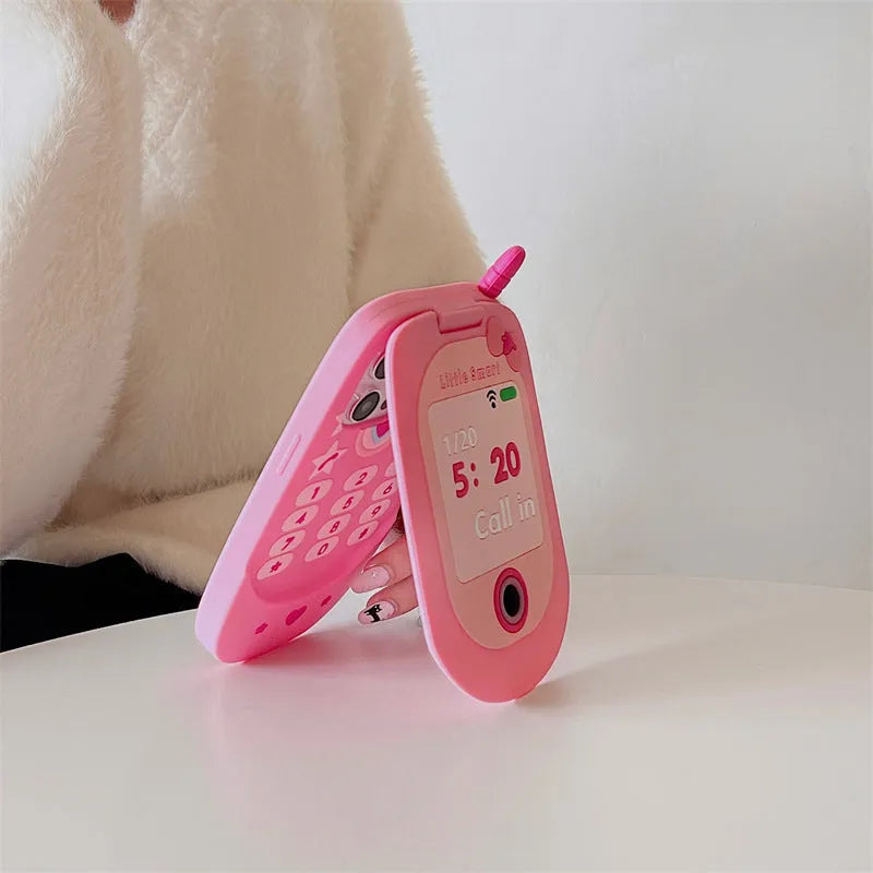 Pink silicone flip phone case with mirror for iPhone models.
