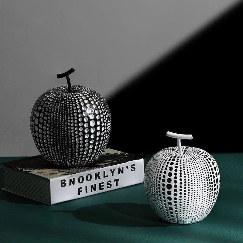 Solid resin apple figurine with smooth apple finish, 17cm high, in black colour on a shelf