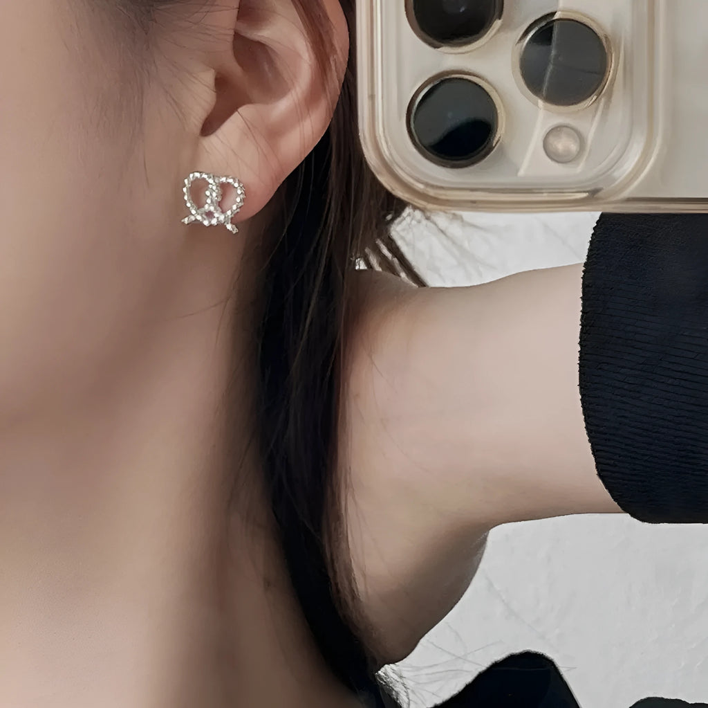 S925 sterling silver stud earrings with love twist cross-knotted geometric design in gold finish