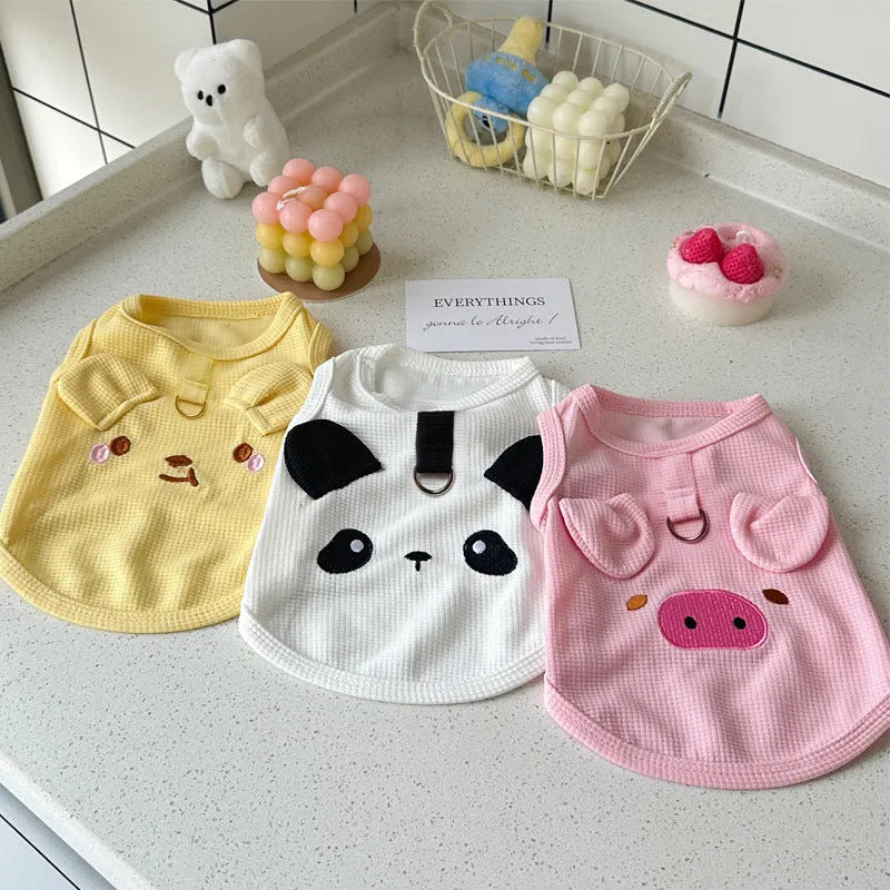 Yellow waffle-knit dog vest on a small dog, showing the textured fabric and casual fit.