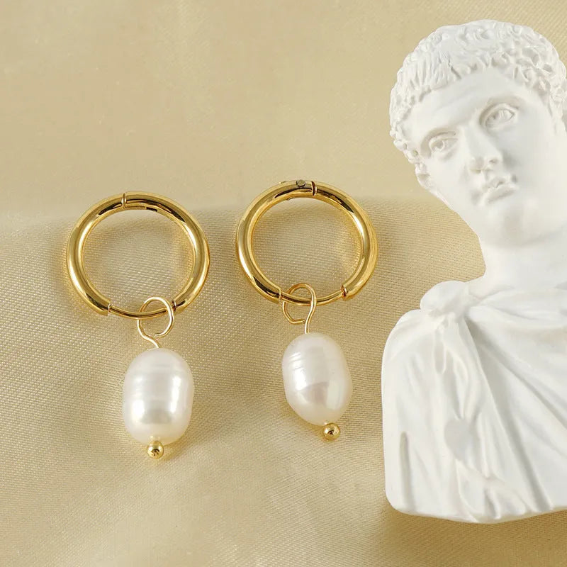 Gold geometric stainless steel earrings with a white pearl accent for women.