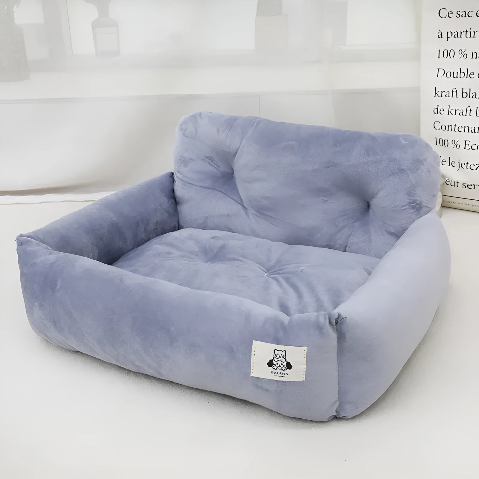 Grey and blue plaid car-mounted cloth nest for dogs, shown in small and large size options.