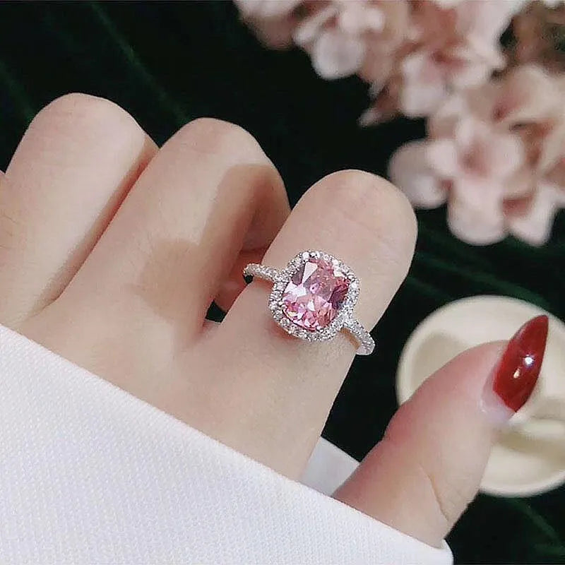 Silver alloy women's ring with artificial gemstone geometric design on white background