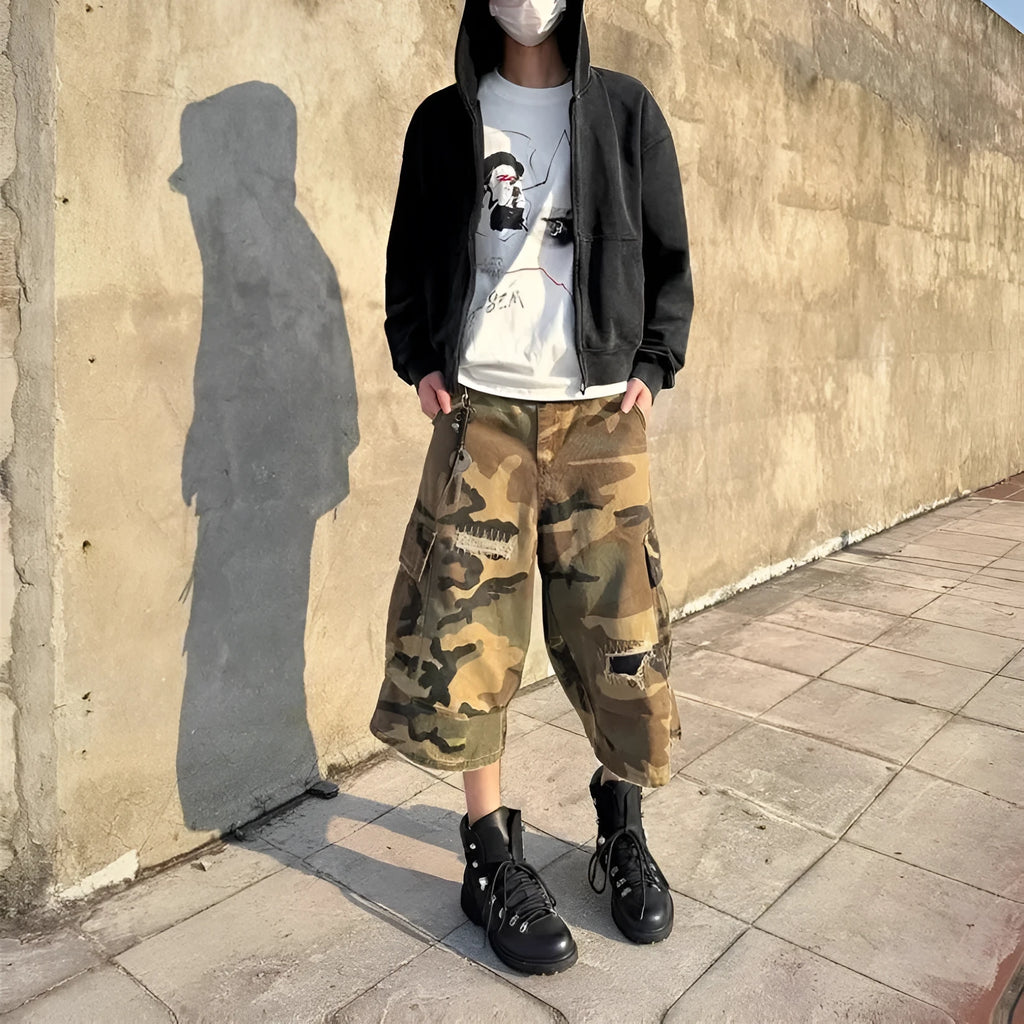 Men's camouflage cropped jeans with ripped detailing and retro patches in loose straight cut