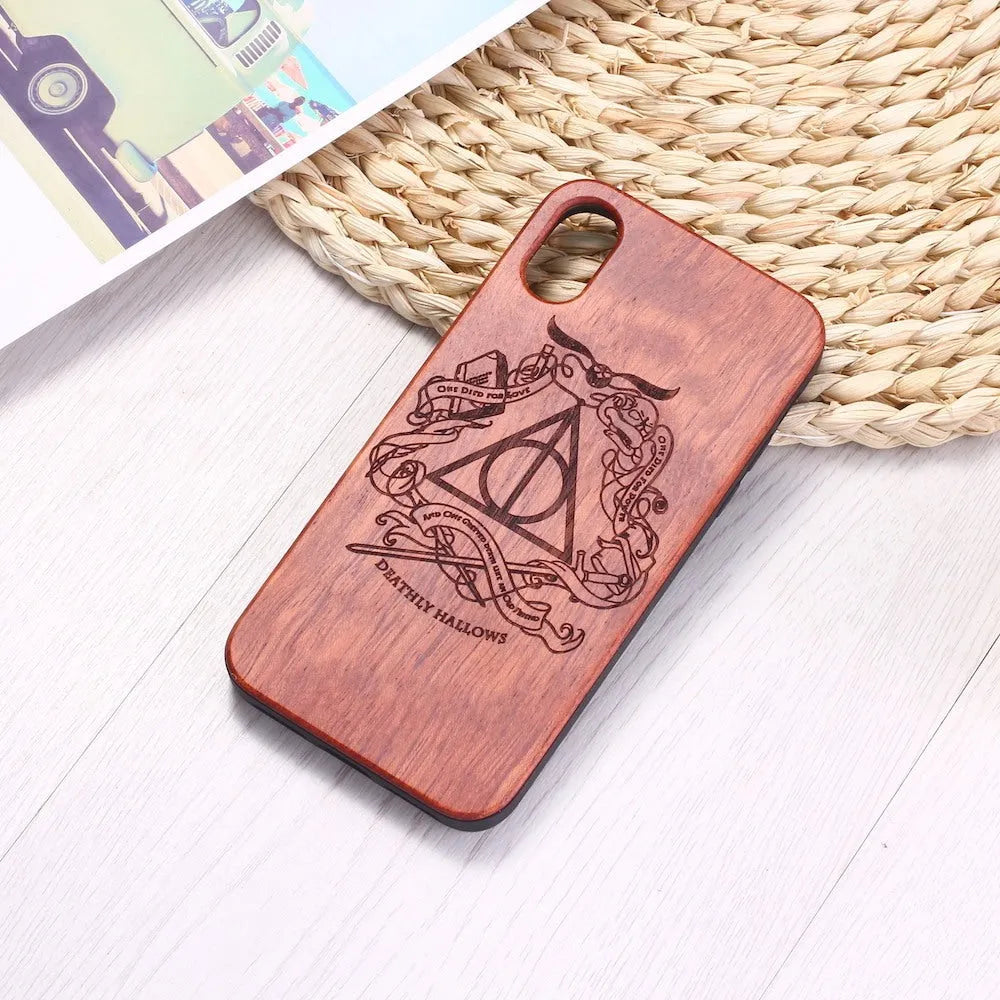 Wooden phone case with laser-carved design on a wooden back and a black TPU frame.