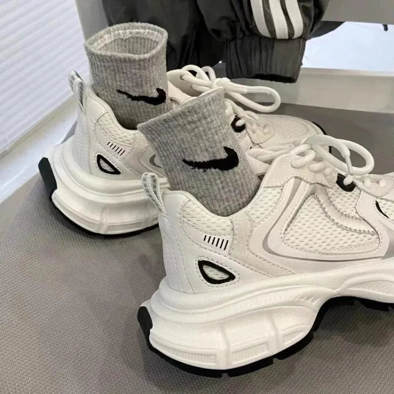 Beige mesh platform casual sports shoes with a wedge heel and front lace-up design on a rubber sole.