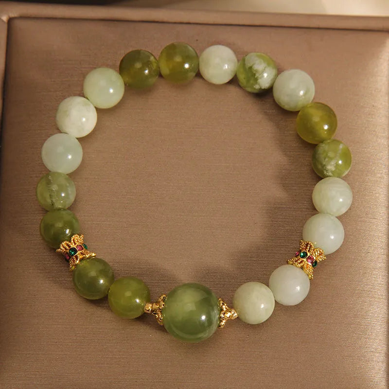 Xiuyan jade women's bracelet in jade green colour with original design.