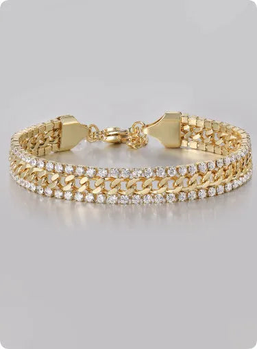 Gold-coloured hip hop style tennis bracelet for men and women on a wrist.