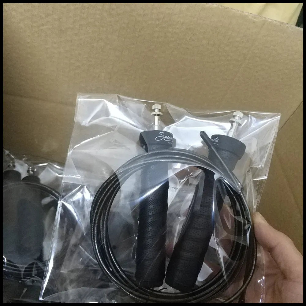 Jump rope for fitness with black PP handle, PU sweat band, and 3m PVC rope on gym floor