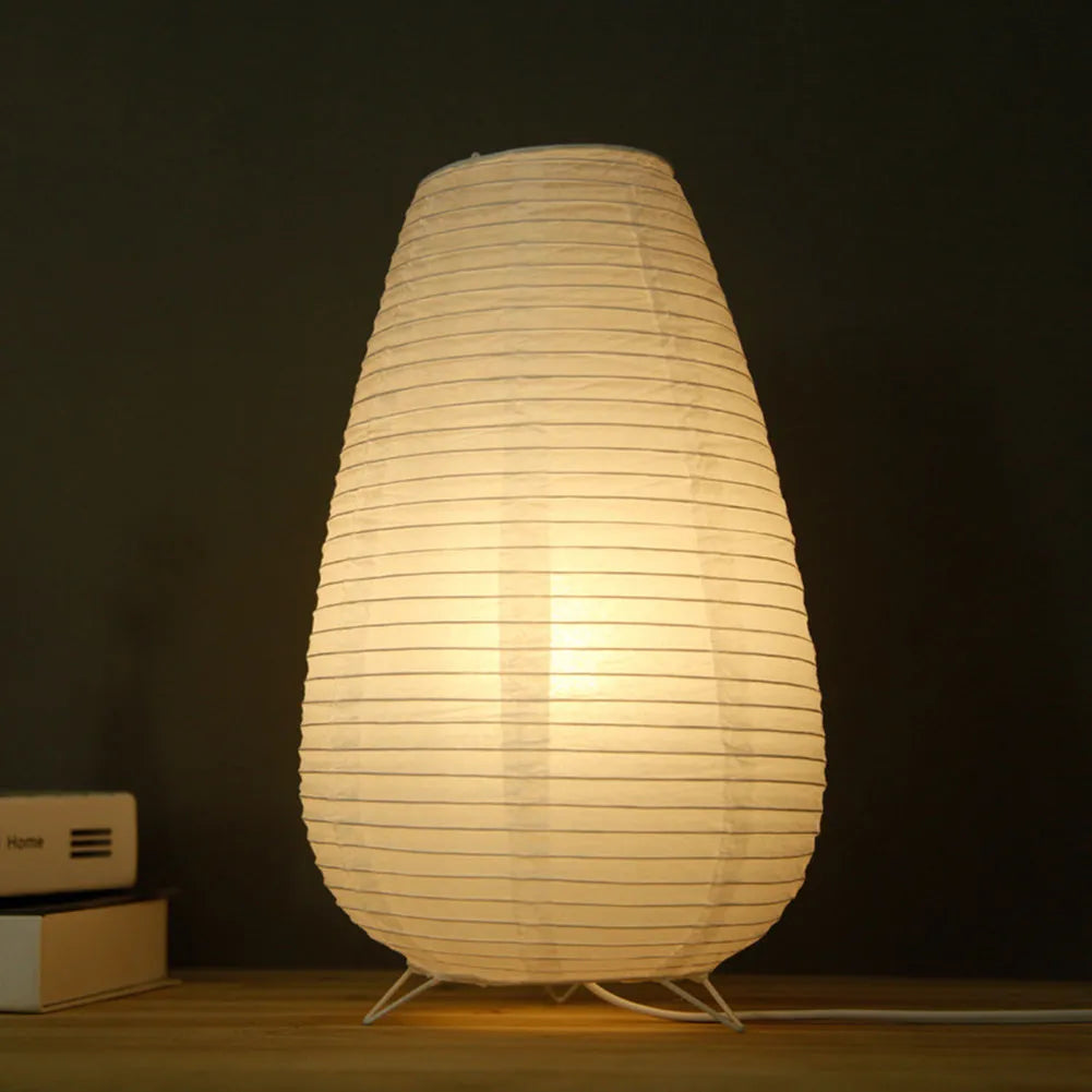 Traditional handmade rice paper table lamp with E14 bulb fitting on bedside table