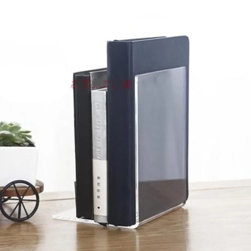 Transparent acrylic bookshelf displaying books on desk