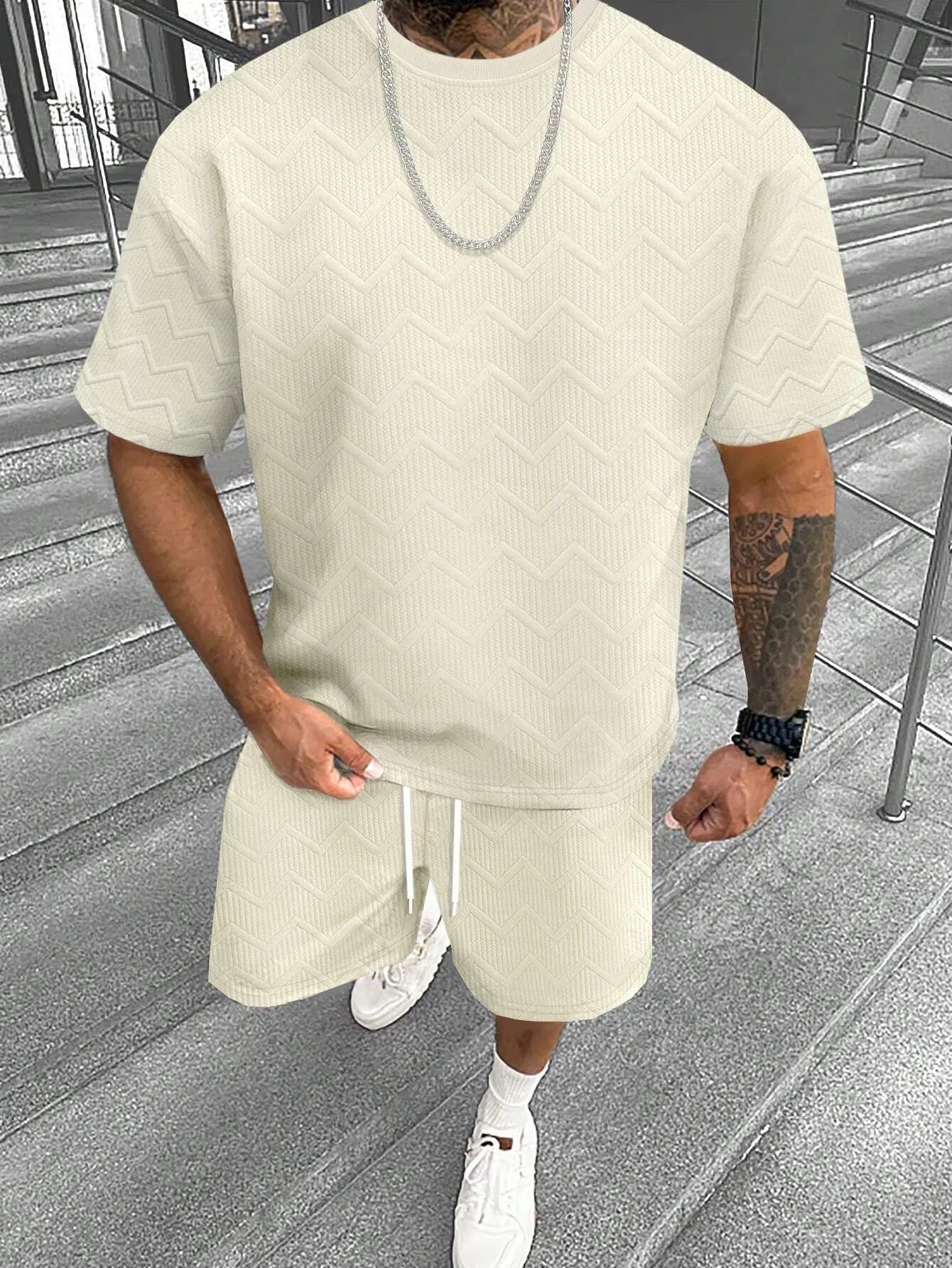 Men's grey short sleeve top and matching shorts suit set for casual leisure wear.